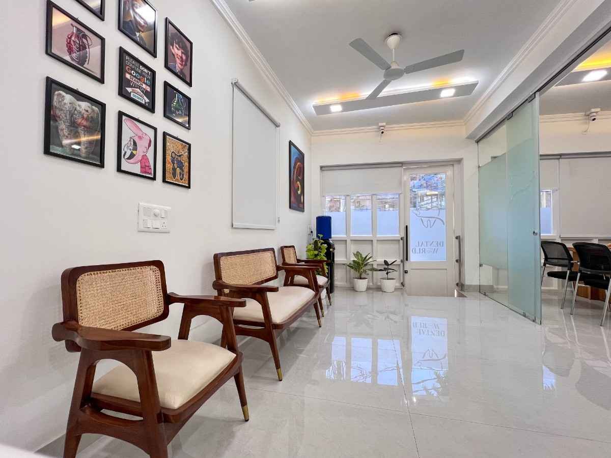 Dental World bright patient waiting area with rattan seating and branded glass entrance